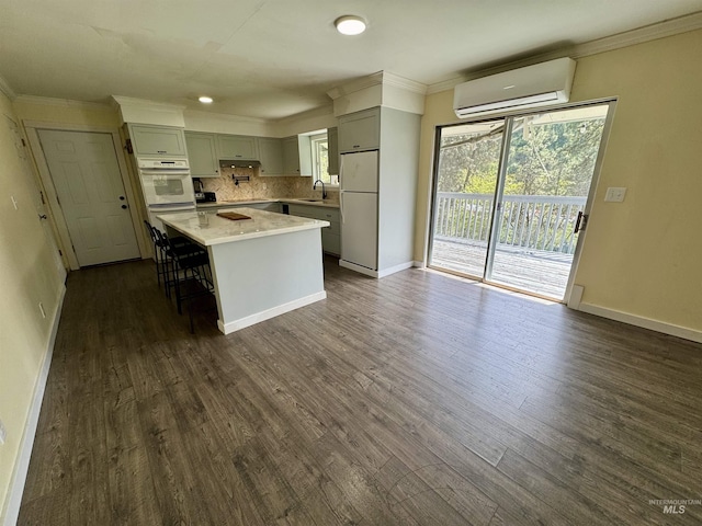 250 Hill Rd, Orofino, ID 83543 - kitchen featuring white appliances, a wall unit AC, ornamental molding, and light countertops