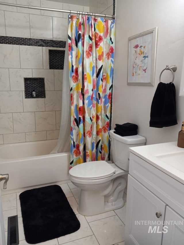 bathroom with visible vents, vanity, toilet, and shower / tub combo