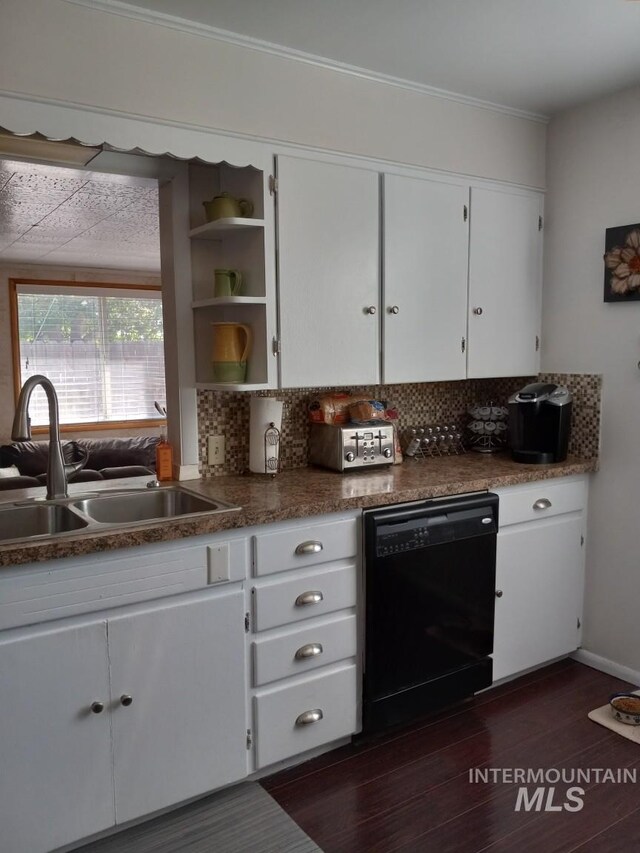 kitchen featuring a sink, black dishwasher, dark wood-style floors, and white cabinetry