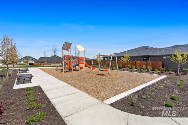 community jungle gym with fence