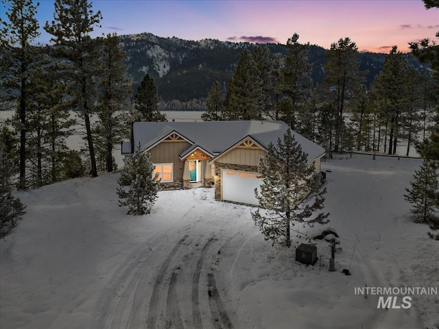 view of front of house featuring a mountain view and a garage