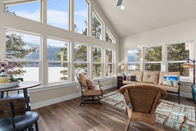 sunroom featuring vaulted ceiling