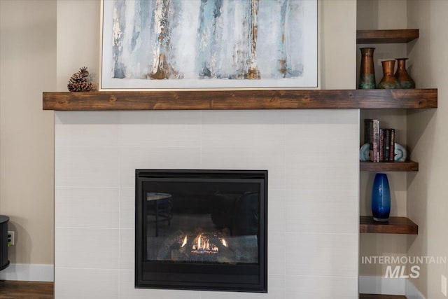 details featuring a tile fireplace