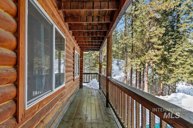 view of snow covered deck