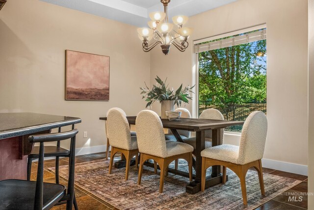 731 E Eaglewoods Ln, Eagle, ID 83616 - dining space featuring a chandelier and baseboards