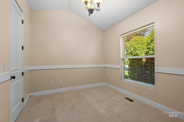 731 E Eaglewoods Ln, Eagle, ID 83616 - empty room featuring vaulted ceiling, carpet floors, and a chandelier