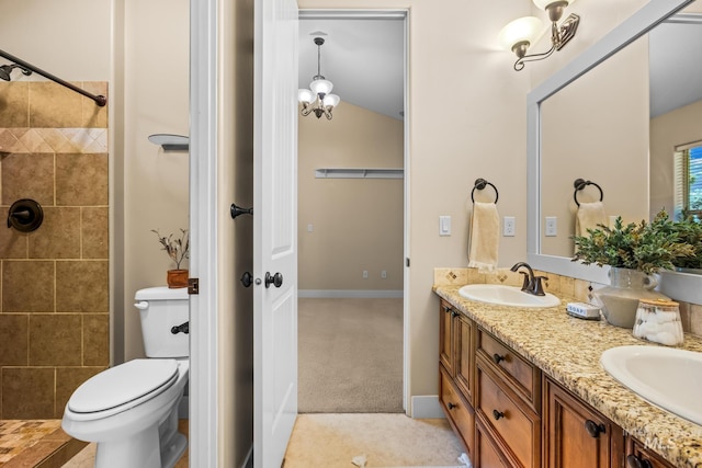 731 E Eaglewoods Ln, Eagle, ID 83616 - bathroom with double vanity, tiled shower, and vaulted ceiling