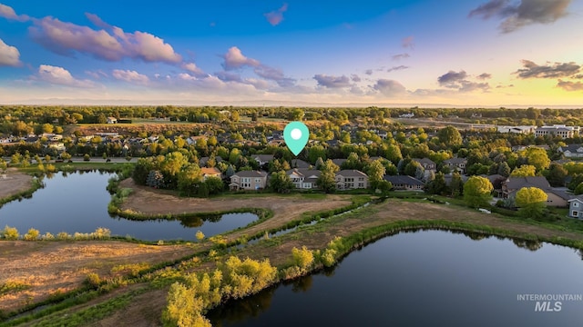 731 E Eaglewoods Ln, Eagle, ID 83616 - aerial view at dusk of a water view and a residential view