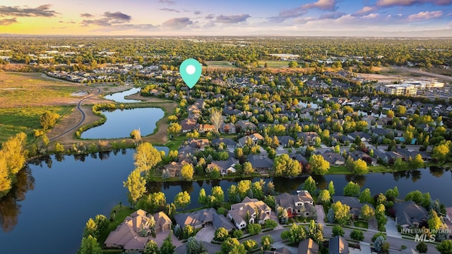 731 E Eaglewoods Ln, Eagle, ID 83616 - aerial view at dusk of a residential view and a water view