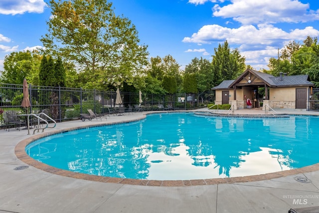 731 E Eaglewoods Ln, Eagle, ID 83616 - community pool with a patio and view of scattered trees