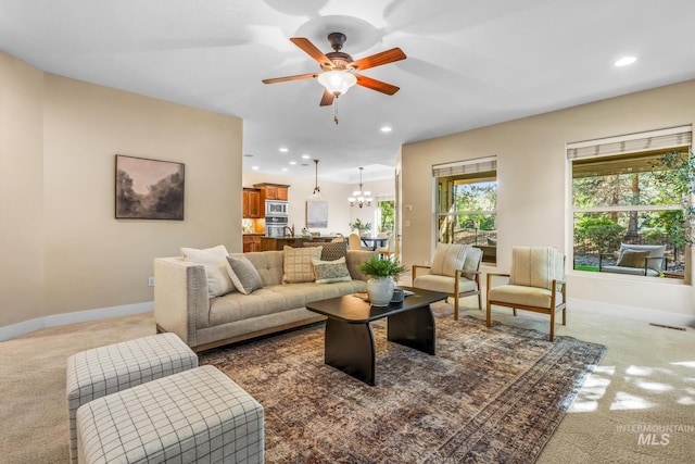 731 E Eaglewoods Ln, Eagle, ID 83616 - living room featuring light carpet, a chandelier, a ceiling fan, and recessed lighting