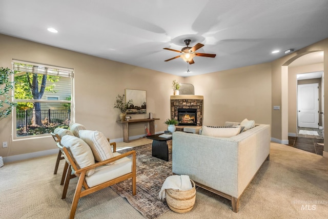 731 E Eaglewoods Ln, Eagle, ID 83616 - living room featuring arched walkways, ceiling fan, a fireplace, carpet flooring, and recessed lighting