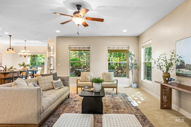 731 E Eaglewoods Ln, Eagle, ID 83616 - carpeted living area featuring a chandelier, recessed lighting, and a ceiling fan