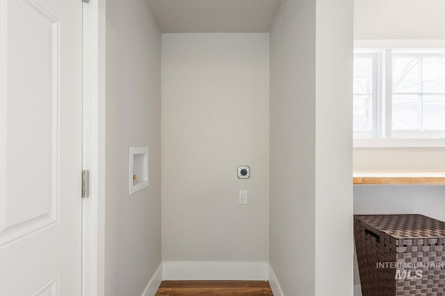 laundry room with washer hookup, wood finished floors, baseboards, hookup for an electric dryer, and laundry area