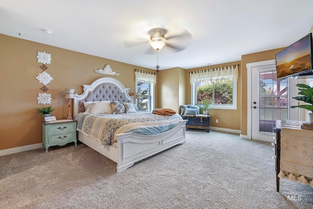 bedroom with light carpet, access to outside, and ceiling fan