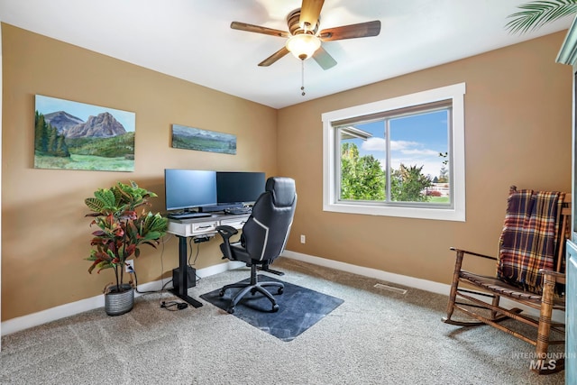 carpeted office with ceiling fan