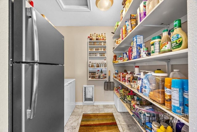 pantry with independent washer and dryer and visible vents