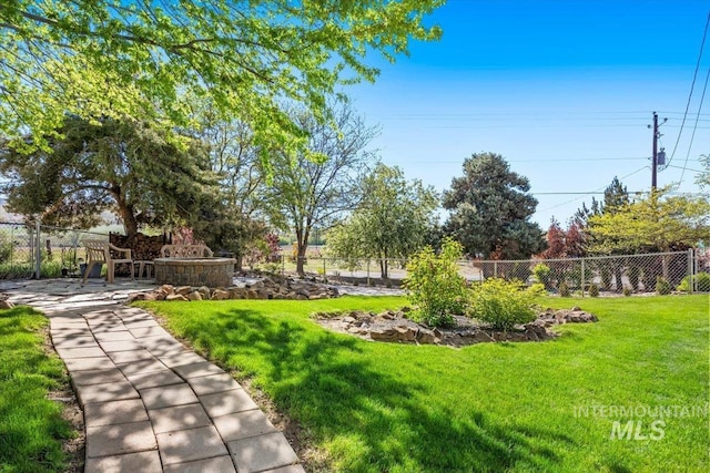 view of yard with a patio and fence
