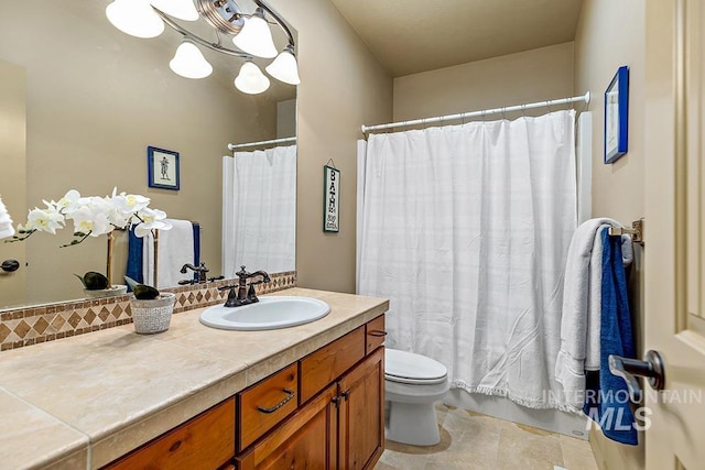 bathroom with a shower with curtain, vanity, and toilet