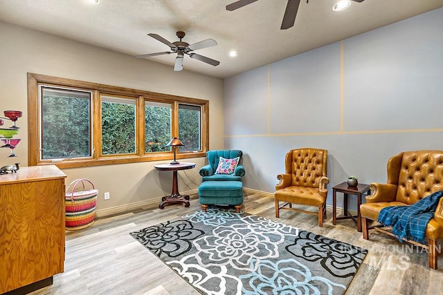 sitting room featuring baseboards, a ceiling fan, wood finished floors, and recessed lighting