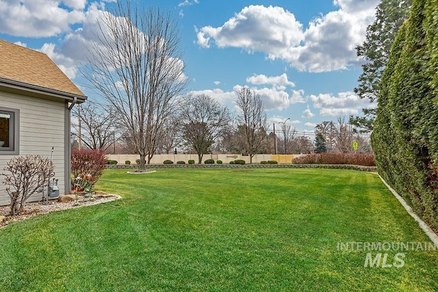 view of yard with fence