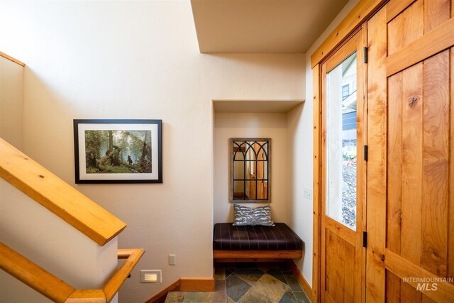 interior space featuring baseboards