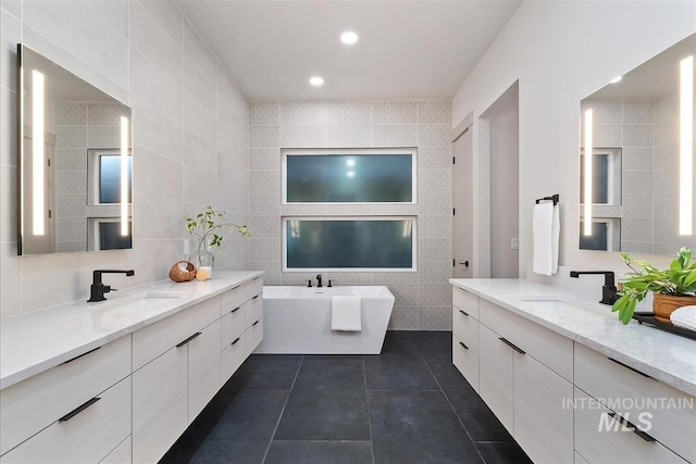 3359 E Warm Springs Ave, Boise, ID 83716 - full bath featuring tile walls, a freestanding tub, tile patterned floors, and two vanities
