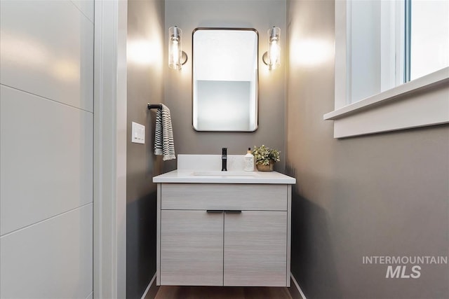 3359 E Warm Springs Ave, Boise, ID 83716 - bathroom with vanity and baseboards