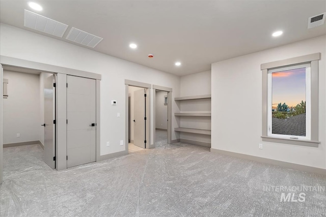 3359 E Warm Springs Ave, Boise, ID 83716 - unfurnished bedroom featuring a walk in closet, carpet, and recessed lighting