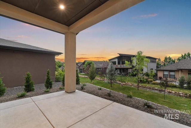 3359 E Warm Springs Ave, Boise, ID 83716 - patio terrace at dusk featuring a patio area