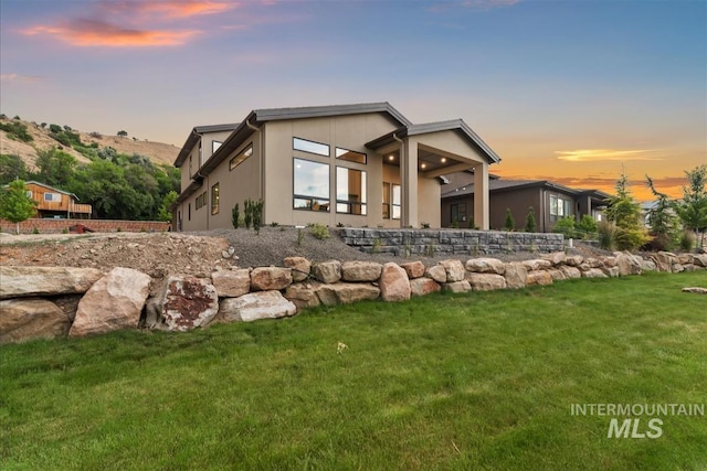 3359 E Warm Springs Ave, Boise, ID 83716 - view of front of property with a front lawn and stucco siding