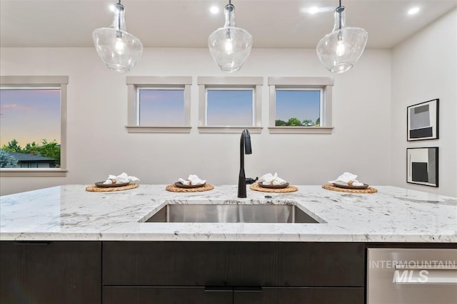 3359 E Warm Springs Ave, Boise, ID 83716 - kitchen with hanging light fixtures, dishwasher, and light stone counters