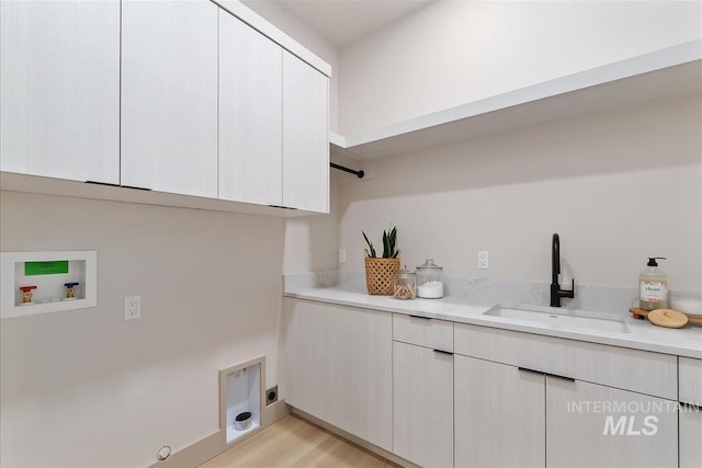3359 E Warm Springs Ave, Boise, ID 83716 - laundry area with cabinet space, washer hookup, light wood-style flooring, and hookup for a gas dryer