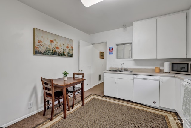 420 E 3rd St, Shoshone, ID 83352 - kitchen featuring dishwasher, stainless steel microwave, a sink, light colored carpet, and light countertops