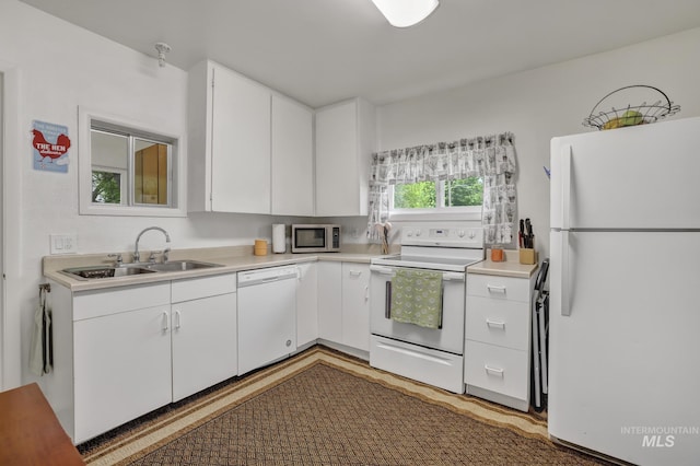 420 E 3rd St, Shoshone, ID 83352 - kitchen with white appliances, a sink, light countertops, and white cabinets