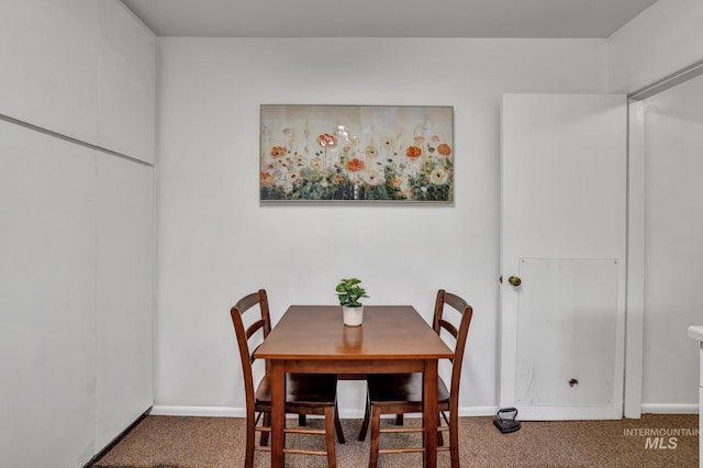 420 E 3rd St, Shoshone, ID 83352 - dining room featuring carpet and baseboards