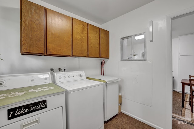 420 E 3rd St, Shoshone, ID 83352 - laundry room featuring cabinet space, washing machine and clothes dryer, dark carpet, and baseboards