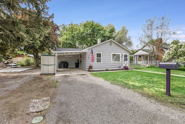 420 E 3rd St, Shoshone, ID 83352 - single story home with a carport, gravel driveway, and a chimney
