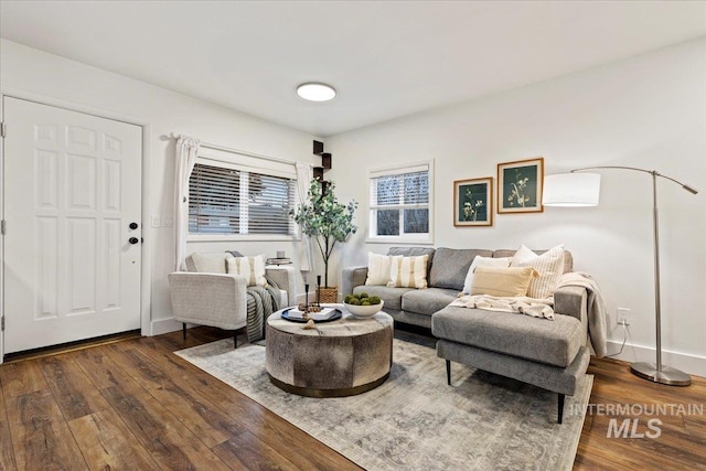 living room with dark hardwood / wood-style flooring