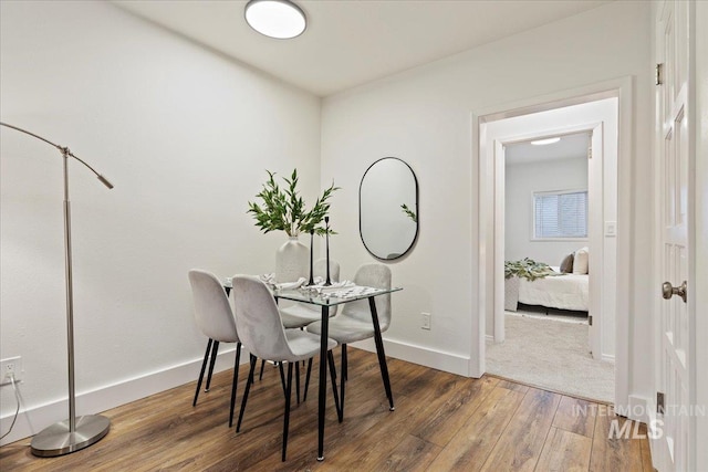 dining area with wood-type flooring