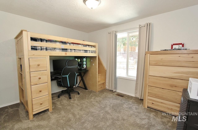 bedroom featuring carpet floors and baseboards
