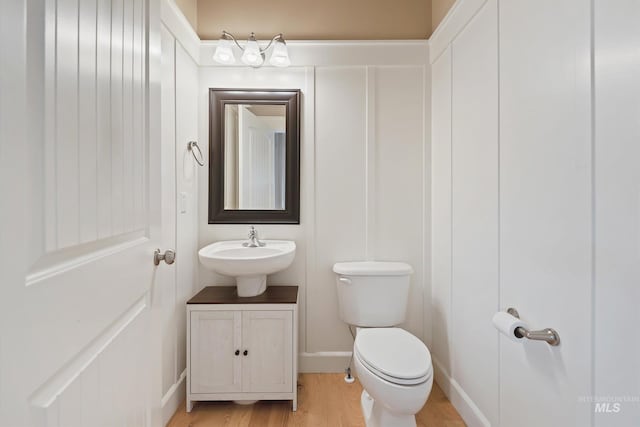 3993 N Heritage View Ave, Meridian, ID 83646 - bathroom featuring toilet, wood finished floors, and vanity