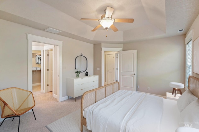 3993 N Heritage View Ave, Meridian, ID 83646 - bedroom featuring a tray ceiling, light carpet, baseboards, and a ceiling fan