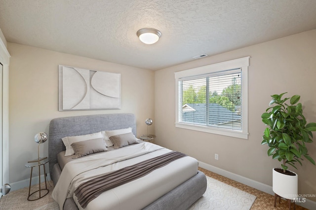 3993 N Heritage View Ave, Meridian, ID 83646 - bedroom featuring baseboards, a textured ceiling, and carpet floors