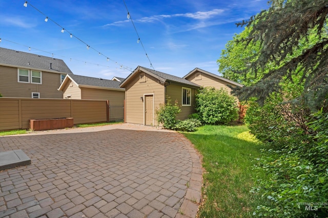 3993 N Heritage View Ave, Meridian, ID 83646 - view of front of home featuring a patio area, an outdoor structure, and a hot tub