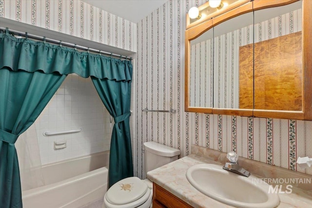 bathroom with wallpapered walls, shower / tub combo, toilet, and vanity