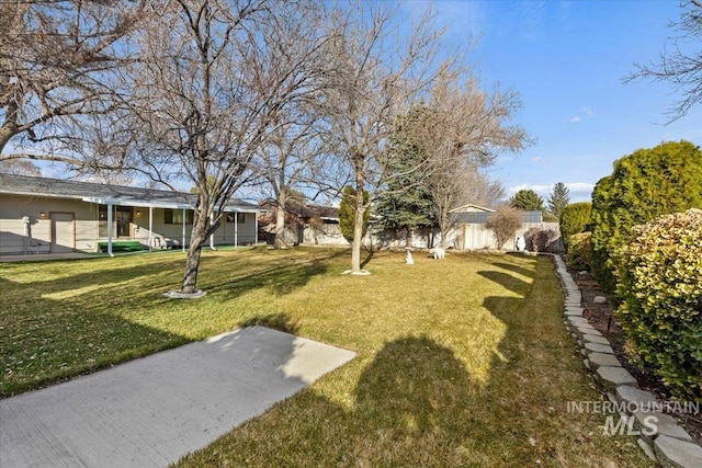 view of yard with fence