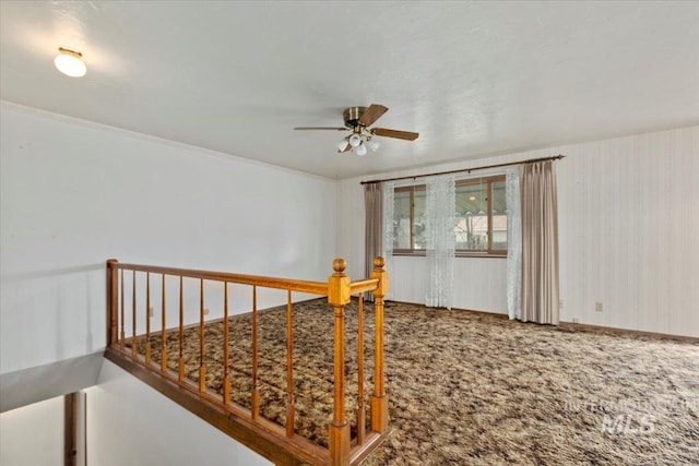 interior space featuring a ceiling fan