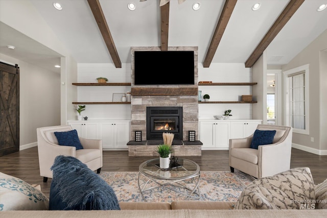 12975 Silversage Dr, Nampa, ID 83686 - living room with a barn door, dark wood-style flooring, a fireplace, and recessed lighting
