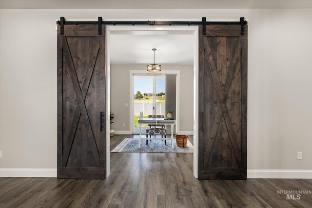 12975 Silversage Dr, Nampa, ID 83686 - foyer featuring a barn door and dark wood-type flooring